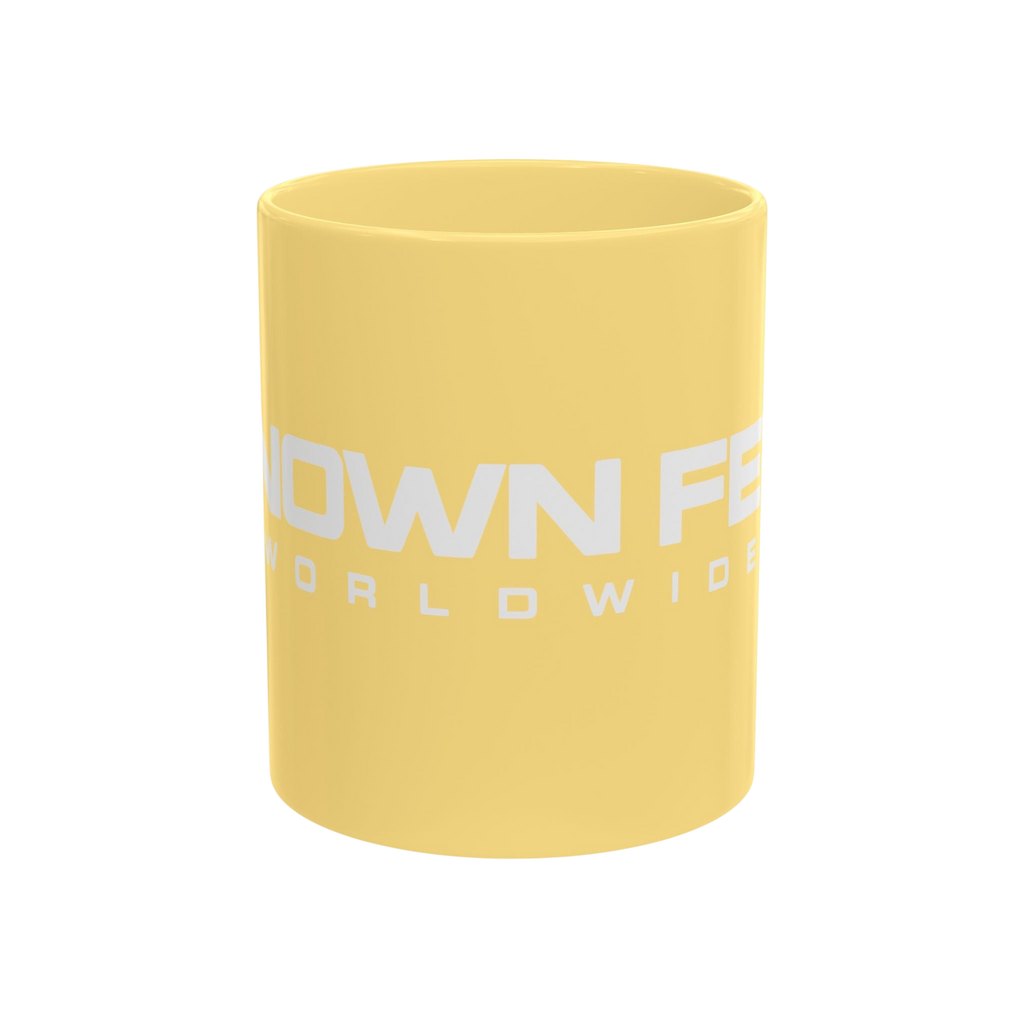 Known Few Worldwide yellow ceramic mug with white brand logo, 11 oz capacity with classic silhouette.