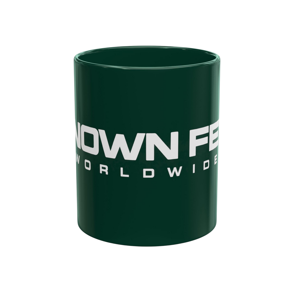 Known Few Worldwide 11 oz dark green ceramic mug with white branded logo and classic C-handle design.